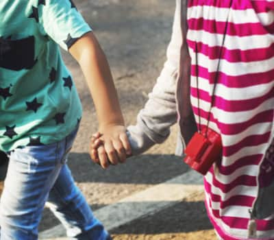 two children holding hands